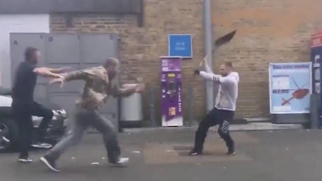 A man is hit over the head with a shovel in a brawl at a petrol station.