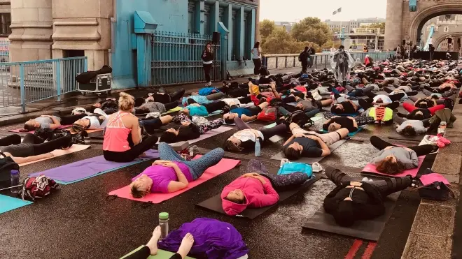 People took to Tower Bridge for a yoga session on the road