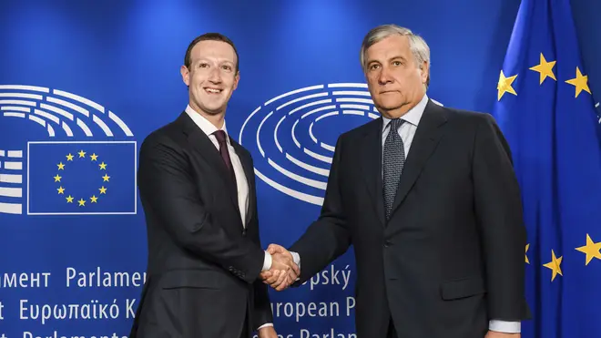 Mark Zuckerberg shakes hands with the President of the European Parliament Antonio Tajani ahead of his testimony in Brussels.