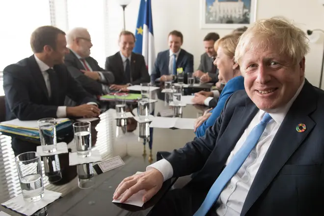 Boris Johnson in a meeting with Emmanuel Macron and Angela Merkel