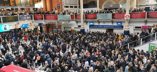 Liverpool Street station is crowded and experiencing flooding