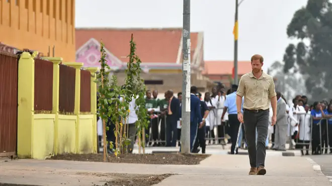 Prince Harry walks down Princess Diana Street in Huambo