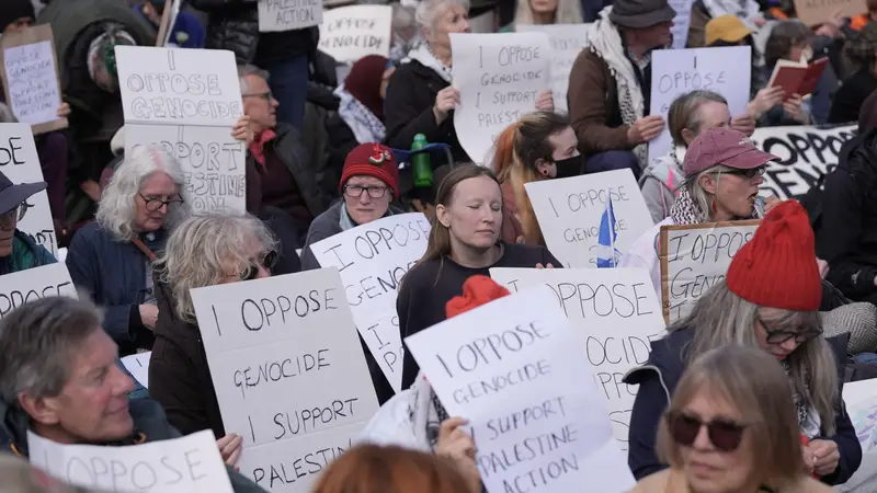 Protesters hold up placards at a demonstration against the ban on Palestine Action in Trafalgar Square