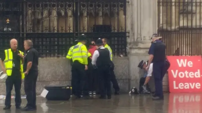 Police sprang into action after a man allegedly doused himself in petrol outside the Houses of Parliament