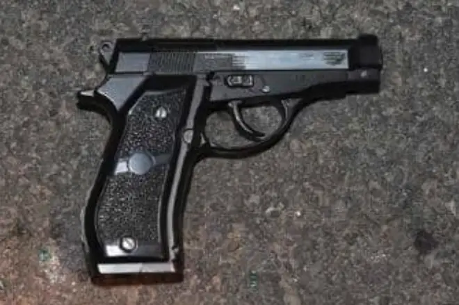 Police searched the crime network's silver Vauxhall and identified a black handgun