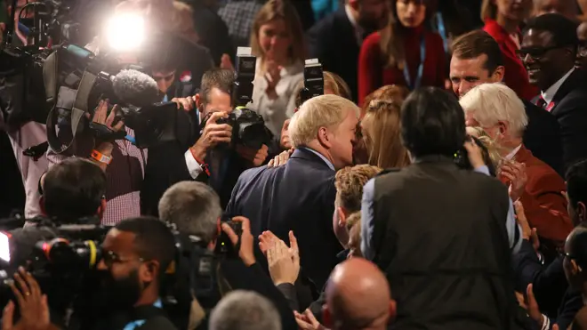 Boris Johnson kisses his girlfriend Carrie Symonds after his speech