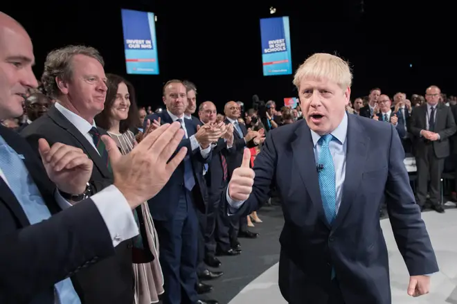 Boris Johnson gave a thumbs up as he left the stage after delivering his speech during the Conservative Party Conference at the Manchester Convention Centre