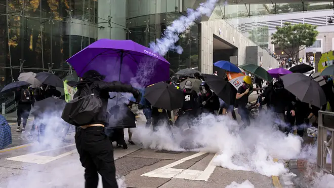 A teenager in Hong Kong has been charged after being shot by police