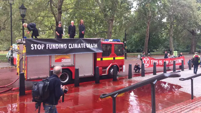 Extinction Rebellion have claimed they have sprayed the Treasury with 1,800 litres of fake blood