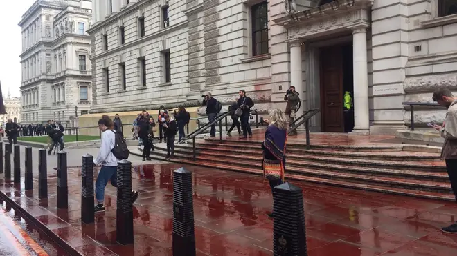 The Treasury building in Whitehall has been doused in fake blood