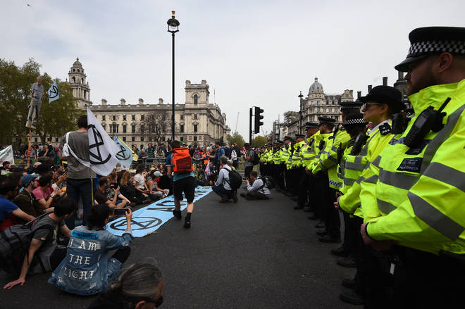 Police watch Extinction Rebellion protesters at Parliament Square in April