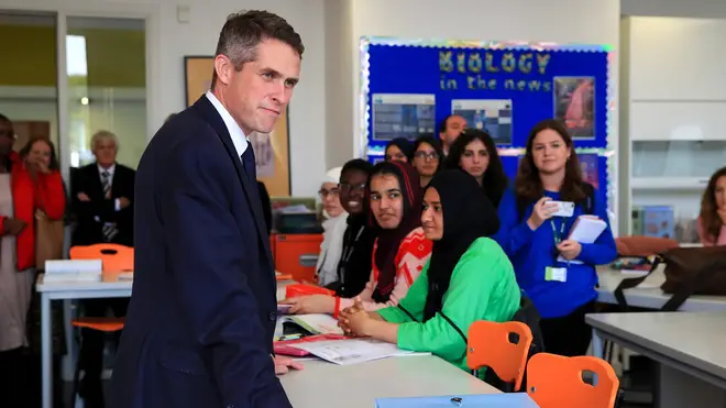 Education Secretary Gavin Williamson talks to students of a biology lesson during a visit to Trafford College