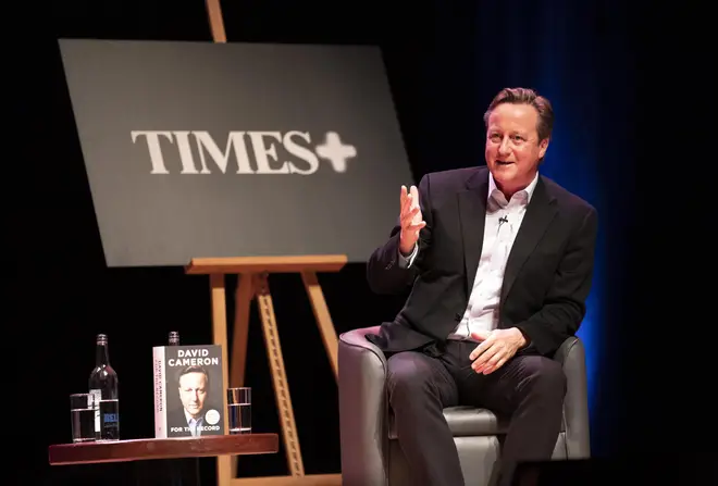 Former prime minister David Cameron speaks with Times editor John Witherow