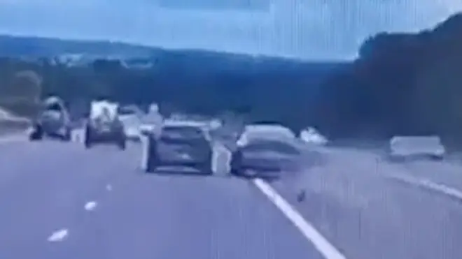 Impatient Audi driver overtakes a car by swerving into the central reservation