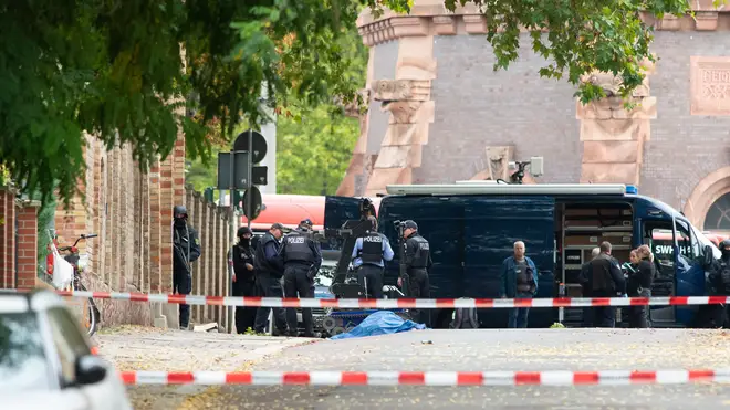 Police seen outside the walls of the synagogue after the shooting
