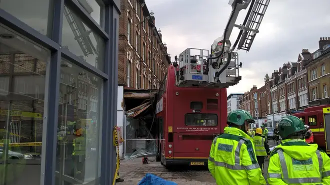 Fire Brigade work to free two people trapped on the bus