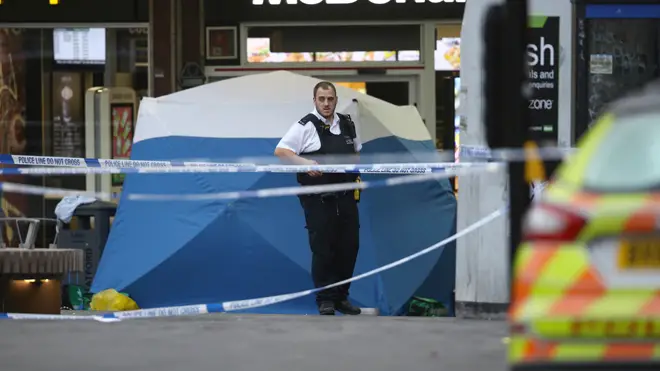 Police at the scene of the fatal stabbing in Stratford