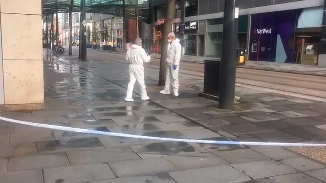 Forensic officers in Manchester where the attack took place