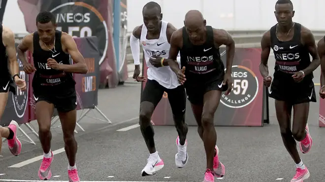 Eliud Kipchoge with pace setters on the start line of his historic effort in Vienna