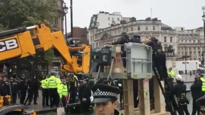 Police dismantle the Extinction Rebellion 'tower' in Trafalgar Square