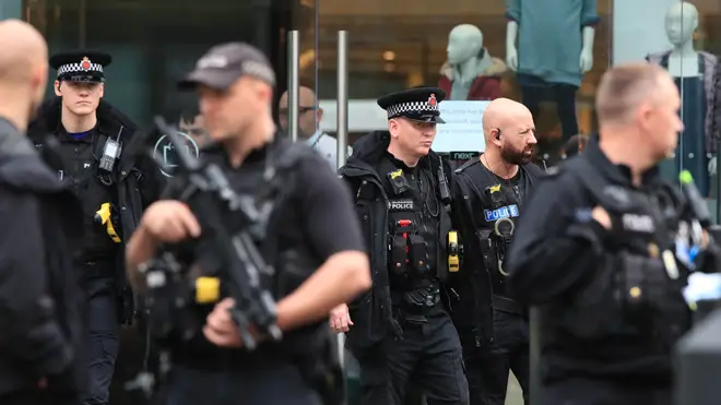 Armed police at the shopping centre yesterday