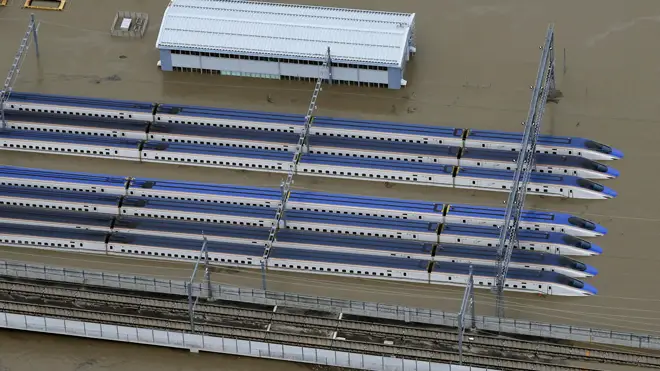 Bullet trains in a flooded depot in Nagano
