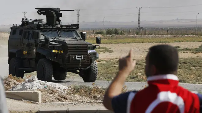 A Turkish police armoured vehicle patrols the border between Turkey and Syria,