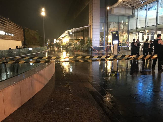 Photo taken with permission from the twitter feed of @AlexSeale of a police cordon at Westfield Shopping Centre in Shepherd's Bush where a man suffered multiple stab wounds.