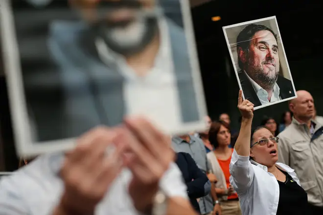 A woman holds a placard with a picture of jailed Catalan separatist leader Oriol Junqueras in Barcelona
