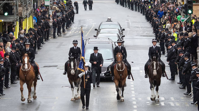 Mourners line the streets for PC Harper's private funeral