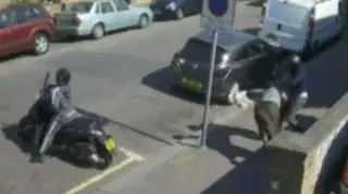 CCTV footage shows the moped gang attacking a 52-year-old woman