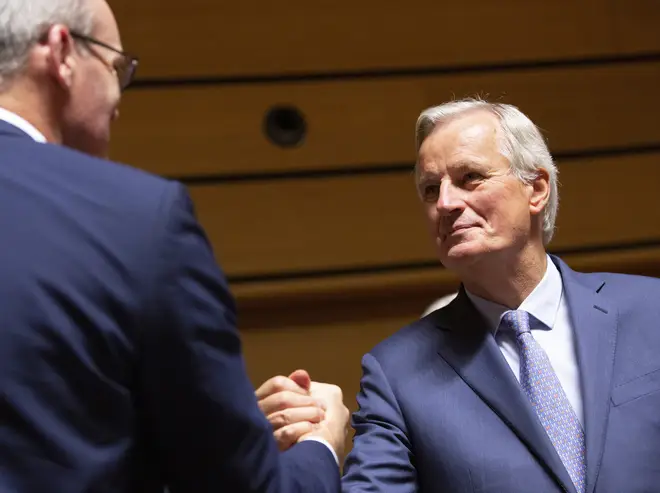 Michel Barnier shakes hands with Ireland's Foreign Secretary Simon Coveney