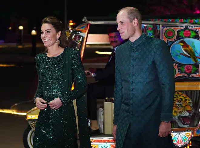 William wears a traditional coat in Pakistan