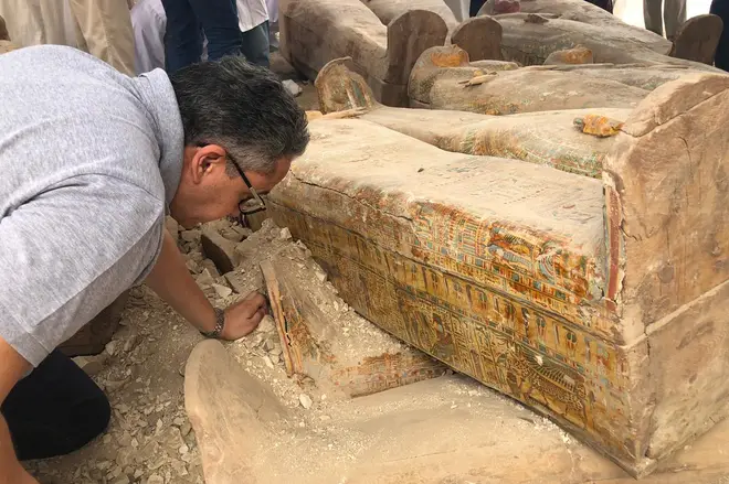 Antiquities minister Khaled El-Anany seen inspecting the finds