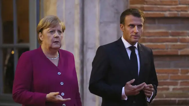 Emmanuel Macron, pictured with Angela Merkel, said he had 'hope' over a possible deal