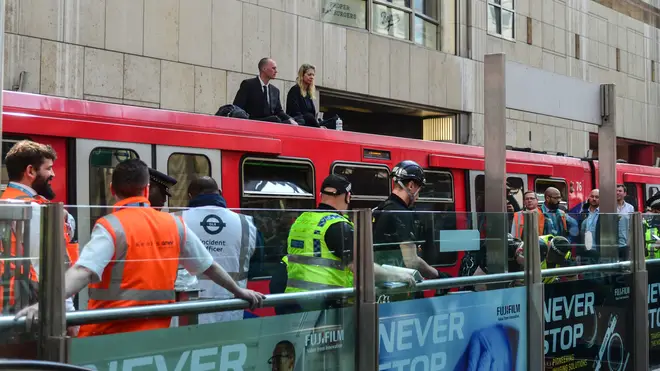During April's protests, two activists climbed onto a DLR train