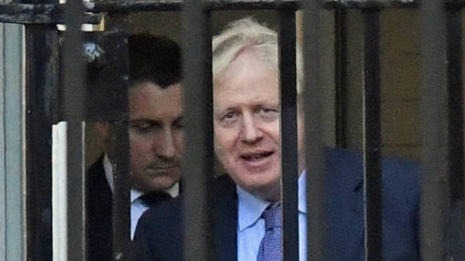 Boris Johnson seen leaving Downing Street via the back door