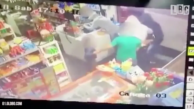 A six-year-old comes to his dads rescue during armed raid on store.