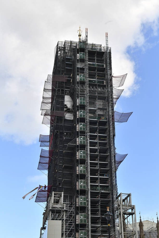 The climate change protester has scaled the scaffolding surrounding Big Ben