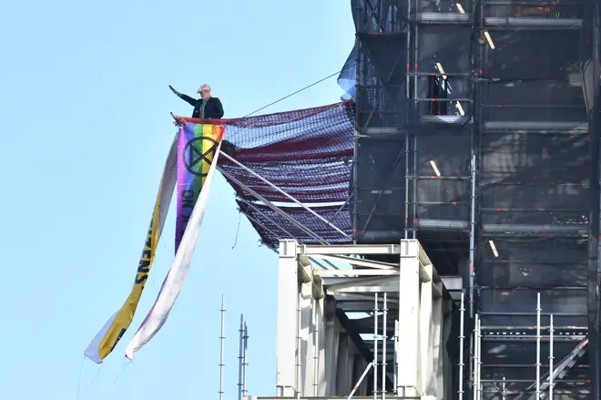 The protester has climbed the scaffolding around Big Ben dressed as the PM