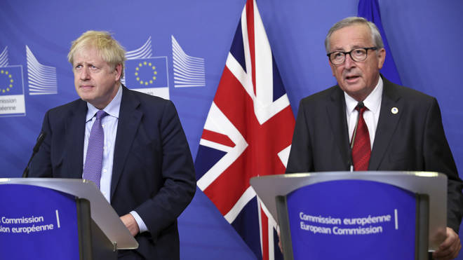 Mr Johnson pictured with European Commission President Jean-Claude Juncker