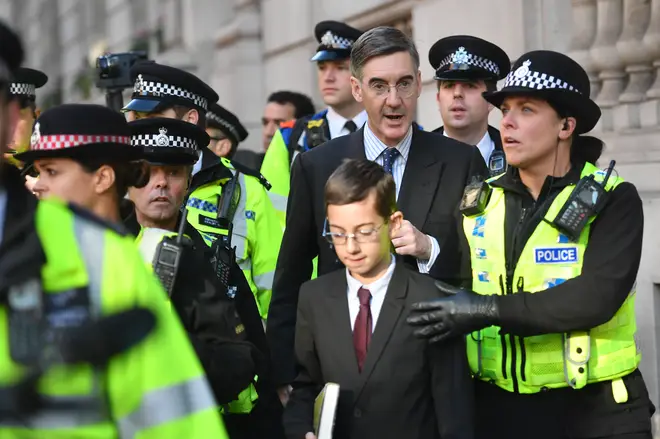 Jacob Rees-Mogg And Son Escorted By Police Through Anti-Brexit Rally