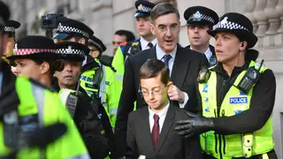 Jacob Rees-Mogg And Son Escorted By Police Through Anti-Brexit Rally