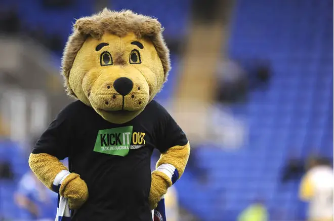 Reading club mascot Kingsley Royal wears a 'Kick It Out' shirt during the pre match warm up.