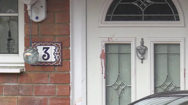 Blood seen on the front door of the home in Milton Keynes
