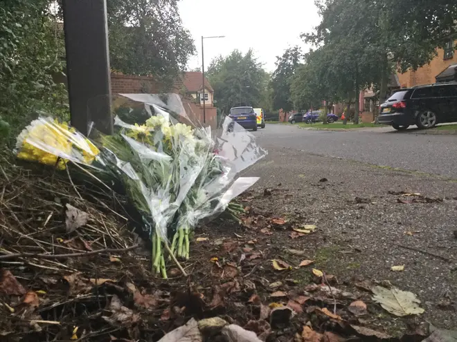 Flowers seen at the scene in Emerson Valley, Milton Keynes