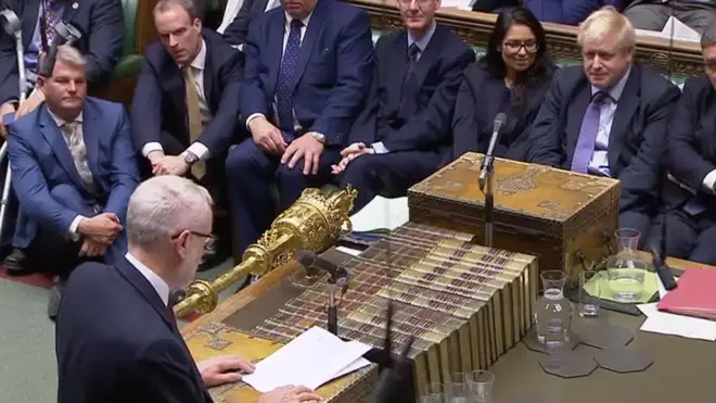Boris Johnson listens to Jeremy Corbyn in the House of Commons