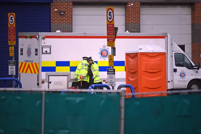 The bodies of 39 people found inside a lorry in Essex are transported under police escort by private ambulance from the Port of Tilbury to Broomfield Hospital in Chelmsford.