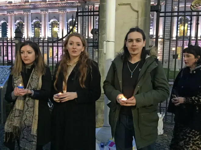 People take part in a vigil outside Belfast City Hall for the 39 people found dead inside a lorry in Essex
