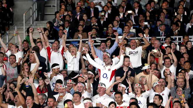 Rugby fans celebrate after England's victory over New Zealand